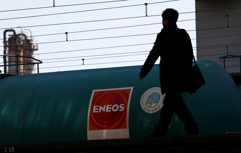 JX Nippon Oil & Energy Corp's Eneos brand logo on a tanker lorry in a train at a station nearby its refinery in Yokohama