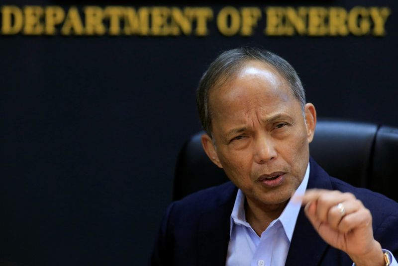 Philippine Department of Energy (DOE) Secretary Alfonso Cusi gestures during a Reuters interview at the DOE headquarters in Taguig city, Metro Manila