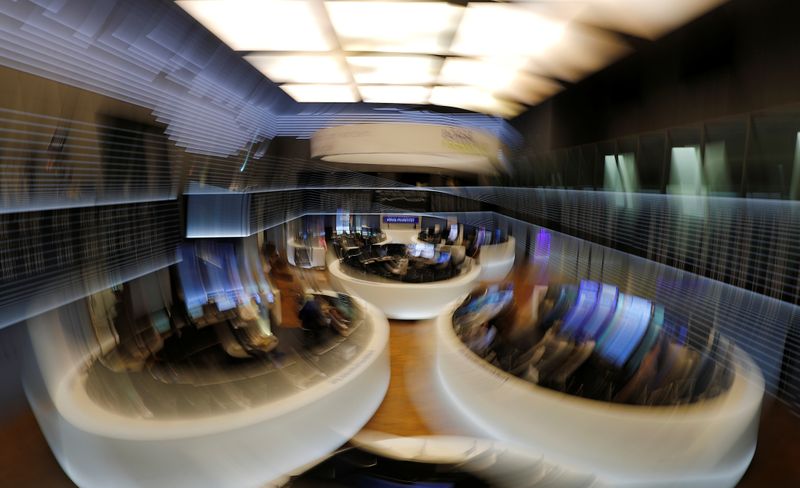 FILE PHOTO: The trading floor is seen at the end of a trading day at the German stock exchange (Deutsche Boerse) in Frankfurt