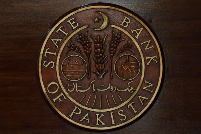 FILE PHOTO: A logo of the State Bank of Pakistan (SBP) is pictured on a reception desk at the head office in Karachi