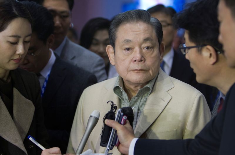 FILE PHOTO: Samsung Electronics Chairman Lee listens to a question from a reporter after touring the Samsung booth at the CES in Las Vegas