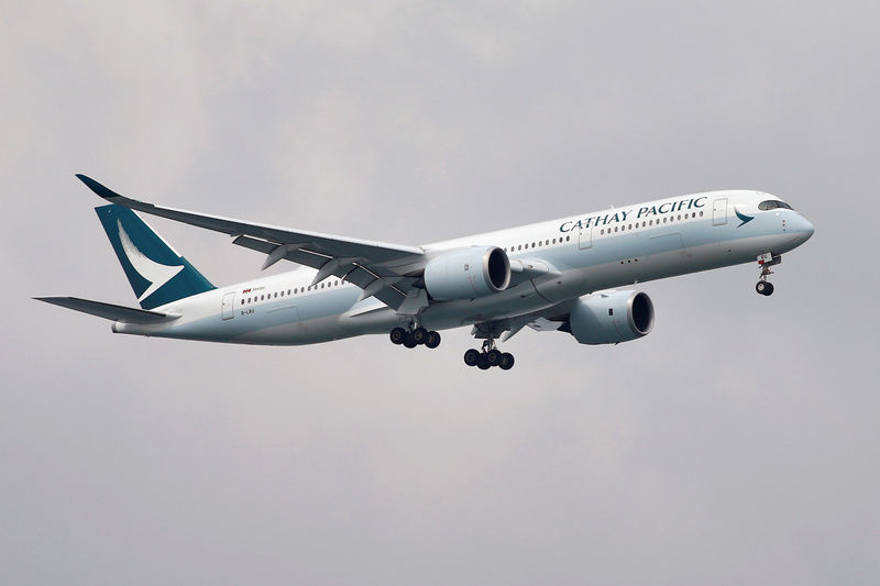 A Cathay Pacific Airways Airbus A350 airplane approaches to land at Changi International Airport in Singapore