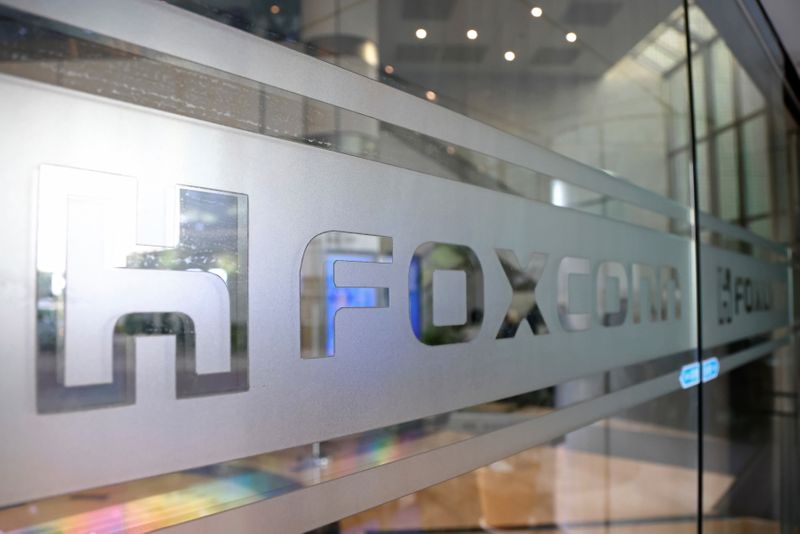 FILE PHOTO: The Foxconn logo is seen on a glass door at its office building in Taipei,