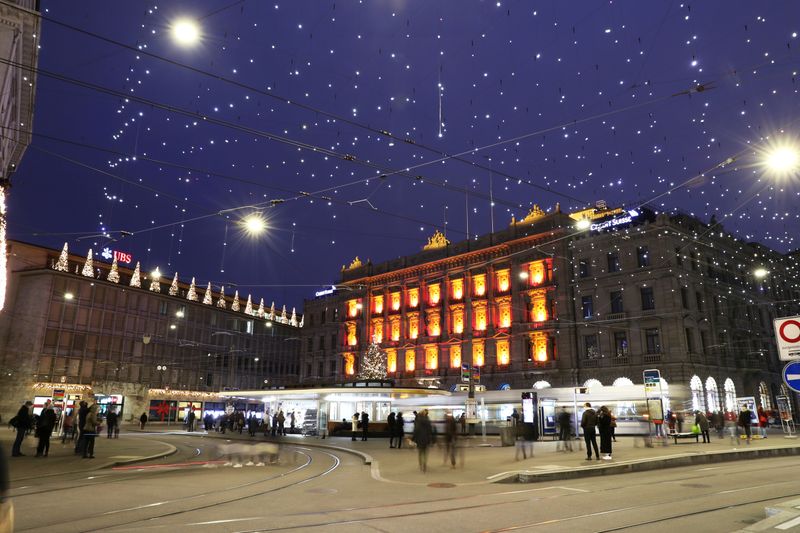 FILE PHOTO: Christmas illuminations are seen on the buildings of Swiss banks UBS and Credit Suisse in Zurich