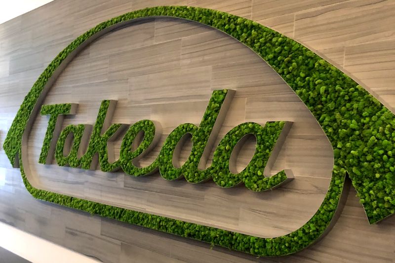 FILE PHOTO: A Takeda logo is seen in its research hub in Cambridge
