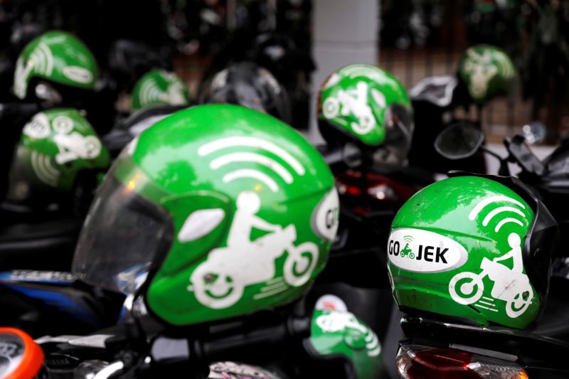 FILE PHOTO: FILE PHOTO: Gojek driver helmets are seen during Go-Food festival in Jakarta