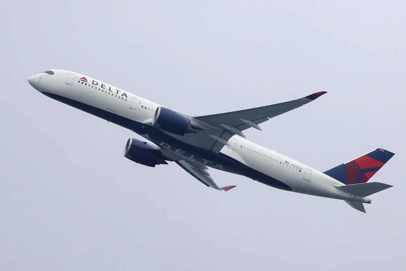 FILE PHOTO: A Delta Air Lines plane takes off from Sydney Airport in Sydney