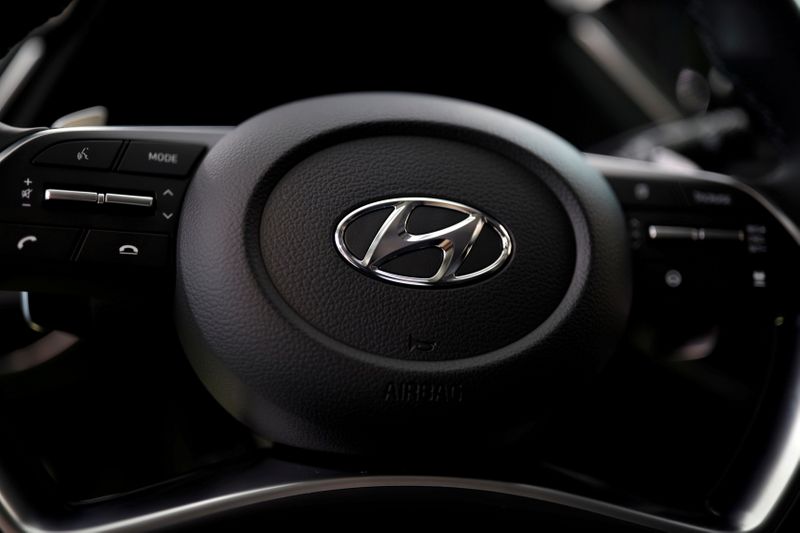 FILE PHOTO: The logo of Hyundai Motors is seen on a steering wheel on display at the company's headquarters in Seoul