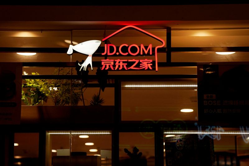 FILE PHOTO: A sign of China's e-commerce company JD.com is seen at its shop at a mall in Shanghai