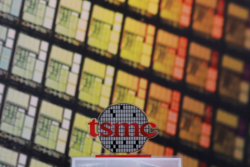 FILE PHOTO: FILE PHOTO: A logo of Taiwan Semiconductor Manufacturing Co (TSMC) is seen at its headquarters in Hsinchu