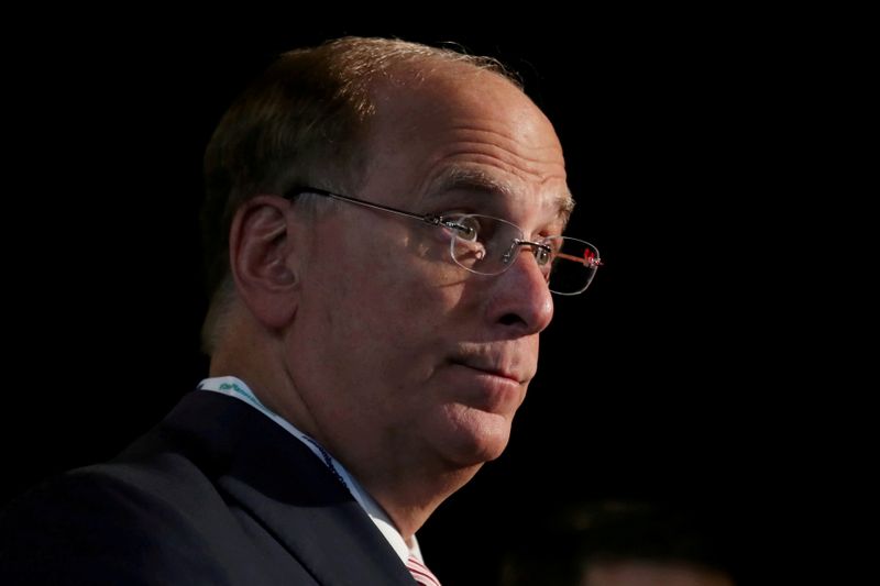 FILE PHOTO: FILE PHOTO: Larry Fink, Chief Executive Officer of BlackRock, stands at the Bloomberg Global Business forum in New York