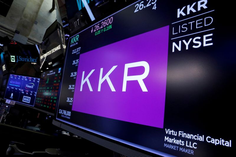 FILE PHOTO: FILE PHOTO: Trading information for KKR & Co is displayed on a screen on the floor of the NYSE in New York