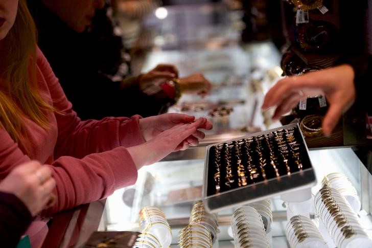 FILE PHOTO: Women shop for jewelry in ALEX AND ANI at the King of Prussia Mall, United States' largest retail shopping space, in King of Prussia