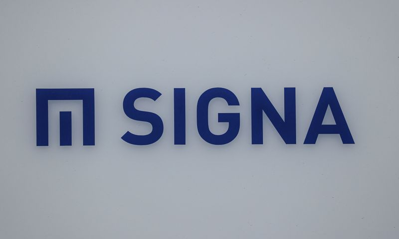 FILE PHOTO: A logo of Signa is pictured on a building nearby the Karstadt sport department store, in Berlin