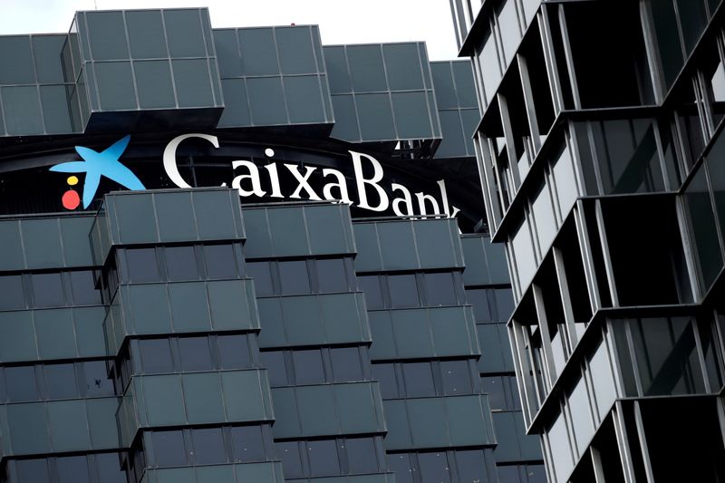 FILE PHOTO: CaixaBank's logo is seen on top of the company's headquarters in Barcelona