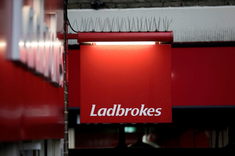 FILE PHOTO: A sign hangs outside a branch of Ladbrokes in London