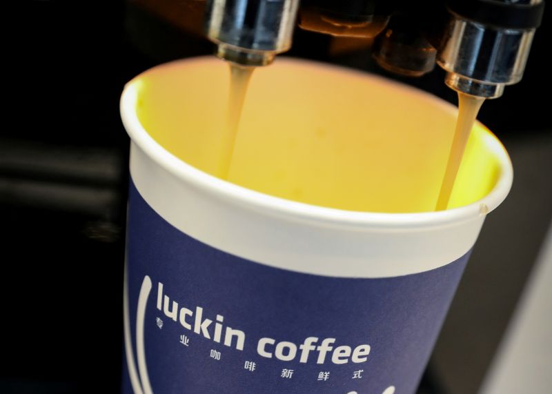 FILE PHOTO: A cup of 'Luckin Coffee' coffee is poured during the company's IPO at the Nasdaq Market site in New York