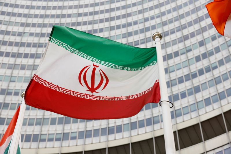 FILE PHOTO: The Iranian flag waves in front of the International Atomic Energy Agency (IAEA) headquarters, in Vienna