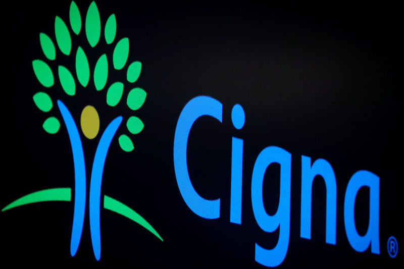 A screen displays the logo fro Cigna Corp. on the floor at the NYSE in New York