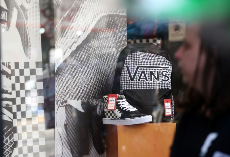 Shoes and backpack of Vans are seen in a shop window in Sao Paulo