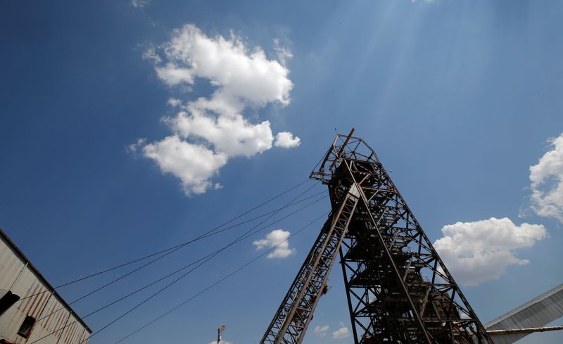 Clouds pass over the pit head at Sibanye Gold's Masimthembe shaft in Westonaria