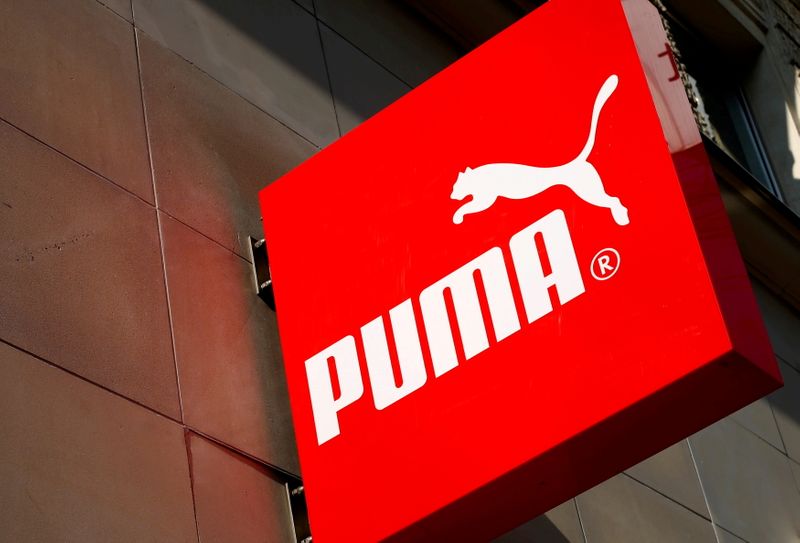 FILE PHOTO: The logo of German sports goods firm Puma is seen at the entrance of one of its stores in Vienna