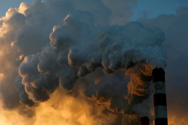 FILE PHOTO: Smoke and steam billows from Belchatow Power Station, Europe's largest coal-fired power plant, near Belchatow, Poland