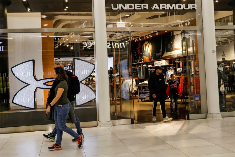 FILE PHOTO: FILE PHOTO: Customers exit an Under Armour store in New York