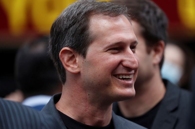 FILE PHOTO: Jason Robins, CEO of DraftKings, smiles after the company's initial public offering (IPO) listing, outside the Nasdaq MarketSite, in New York City