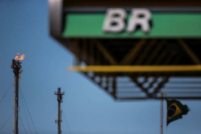 The logo of state-run oil company Petrobras is seen in front of the Brazilian national flag at the Alberto Pasqualini Refinery in Canoas
