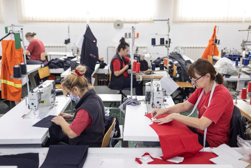 Workers sew cloths at the Jugotex textile factory in Smederevo