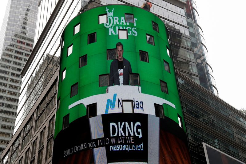 FILE PHOTO: Jason Robins, CEO of DraftKings, is displayed at the Nasdaq MarketSite jumbotron, in New York City