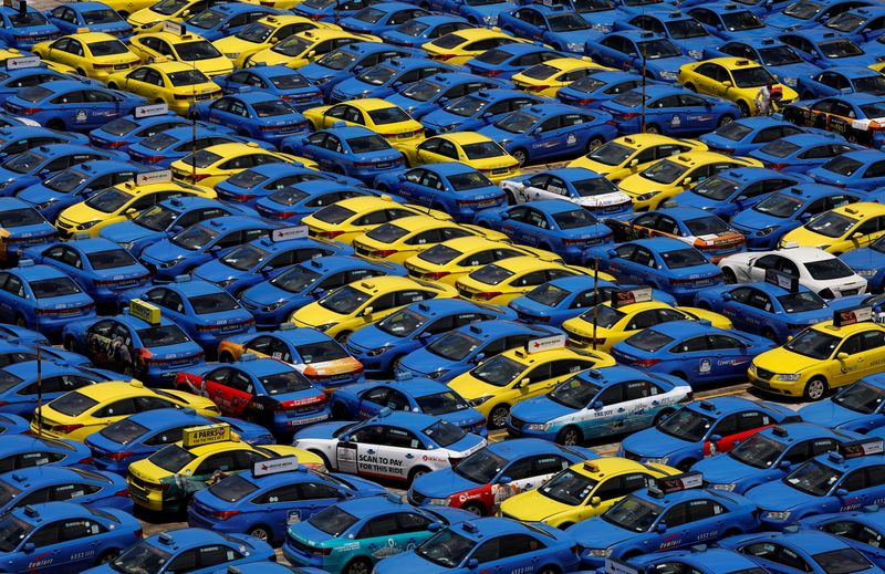 FILE PHOTO: ComfortDelGro's taxis are parked at their vehicle inspection yard in Singapore