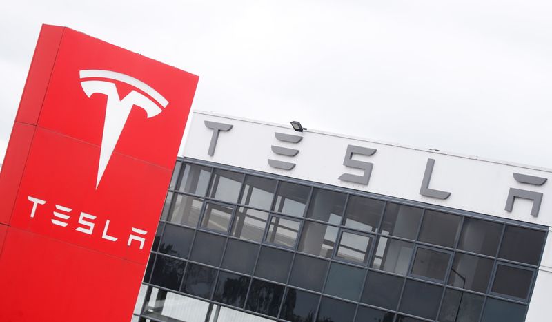 FILE PHOTO: The logo of car manufacturer Tesla is seen at a dealership in London