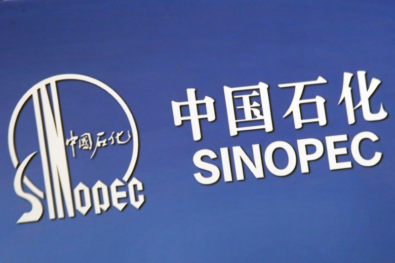 FILE PHOTO: The company logo of China’s Sinopec Corp is displayed at a news conference in Hong Kong