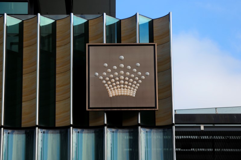 FILE PHOTO: The logo of Australian casino giant Crown Resorts Ltd adorns the hotel and casino complex in Melbourne, Australia
