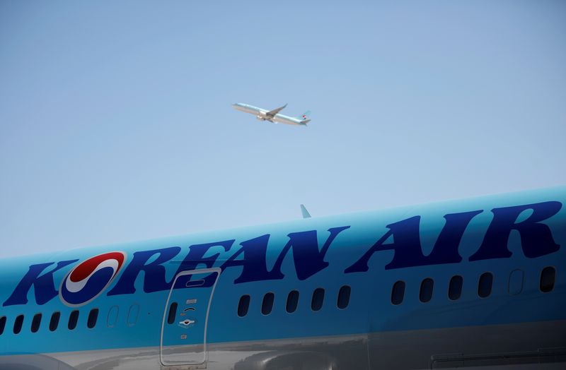 FILE PHOTO: The logo of Korean Airlines is seen on a B787-9 plane at its aviation shed in Incheon, South Korea