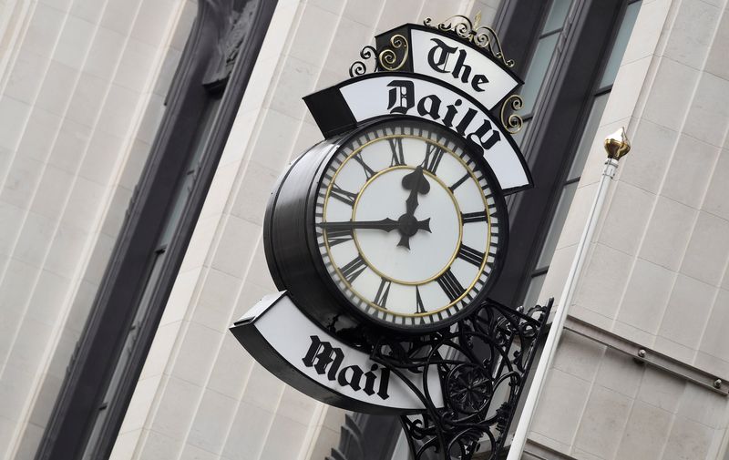 FILE PHOTO: A clock face is seen outside of the London offices of the Daily Mail newspaper in London, Britain
