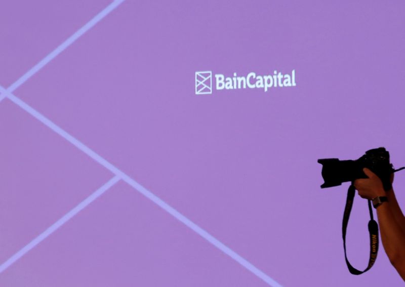 FILE PHOTO: The logo of Bain Capital is displayed on the screen during a news conference in Tokyo