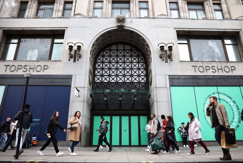 People walk past 214 Oxford Street, the former flagship store of British fashion chain Topshop, that has been purchased by the Swedish furniture brand IKEA