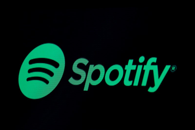 FILE PHOTO: The Spotify logo is displayed on a screen on the floor of the NYSE in New York