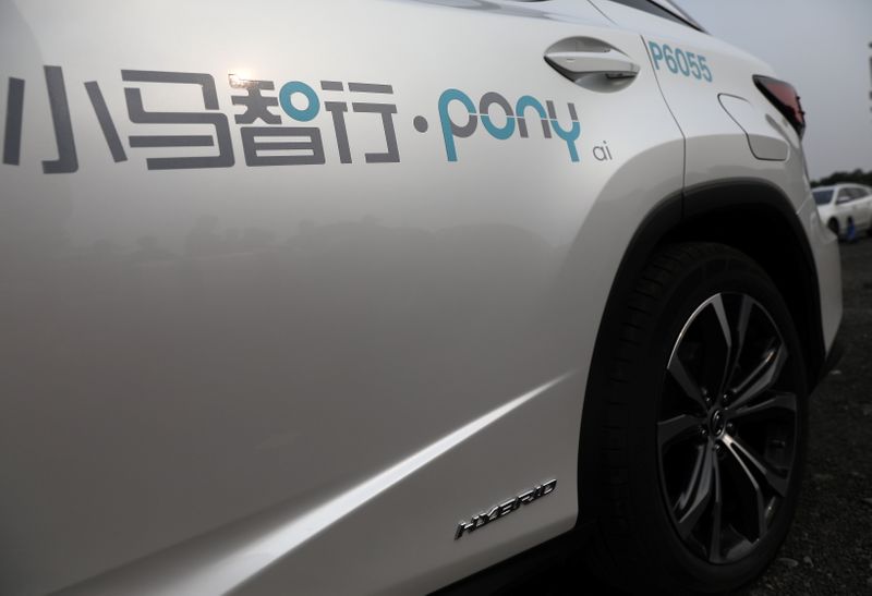 Logo of Pony.ai is seen on a Lexus vehicle equipped with the company's autonomous driving system, in Beijing