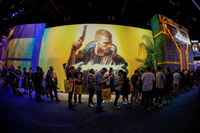 FILE PHOTO: Attendees wait in line during the opening day of E3, the annual video games expo revealing the latest in gaming software and hardware in Los Angeles