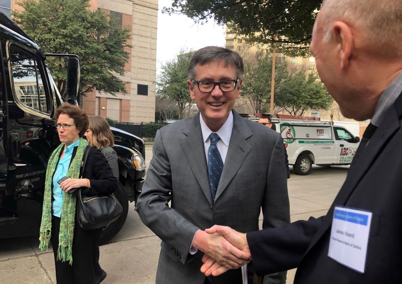 Federal Reserve Vice Chairman Clarida greets a member of the Dallas Fed staff in Dallas