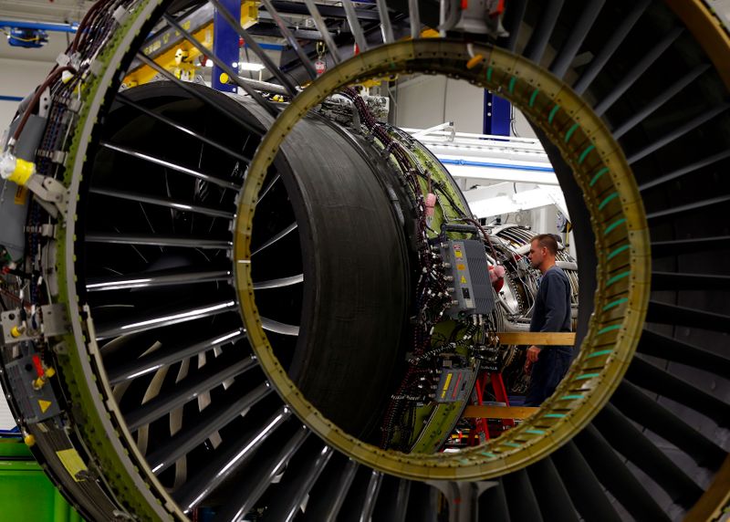 FILE PHOTO: A General Electric employee inspects a jet engine at the GE Aviation Peebles Test Operations Facility in Peebles, Ohio