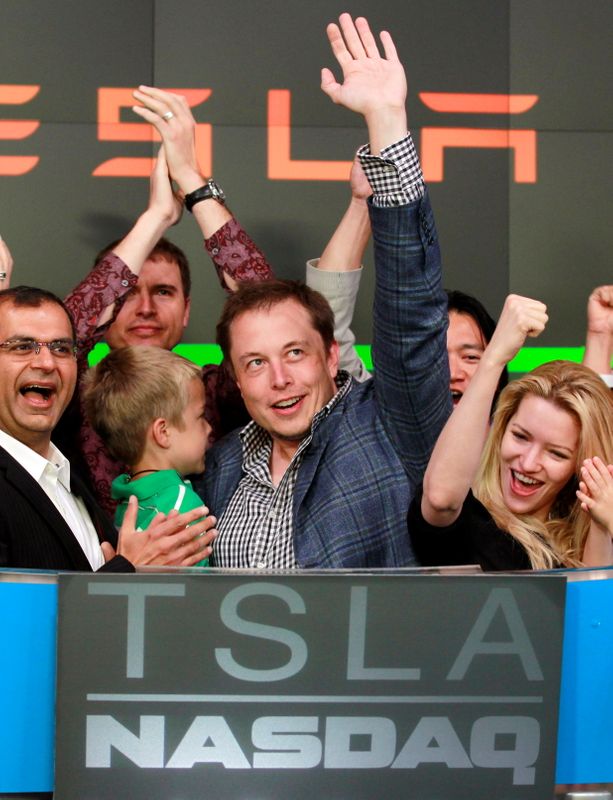 FILE PHOTO: CEO of Tesla Motors Elon Musk waves after ringing the opening bell at the NASDAQ market in celebration of his company's initial public offering in New York