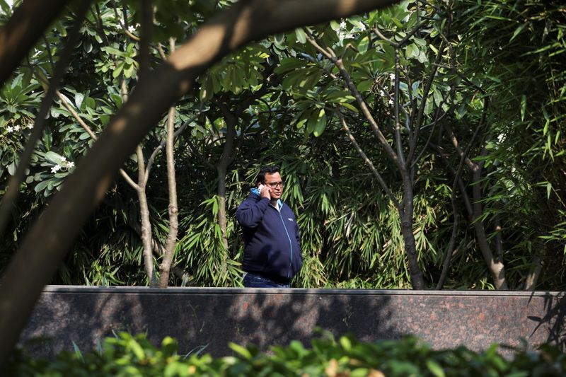 Paytm founder and CEO Vijay Shekhar Sharma talks on the phone at a clubhouse of a residential building in New Delhi