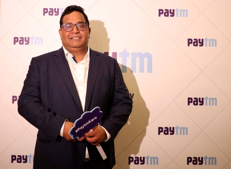 Paytm founder and CEO Vijay Shekhar Sharma poses during his company's IPO listing ceremony at the Bombay Stock Exchange in Mumbai