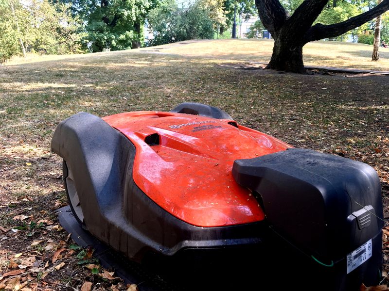 FILE PHOTO: A Husqvarna robotic lawn mower is placed in its docking station in the Humlegarden park in Stockholm