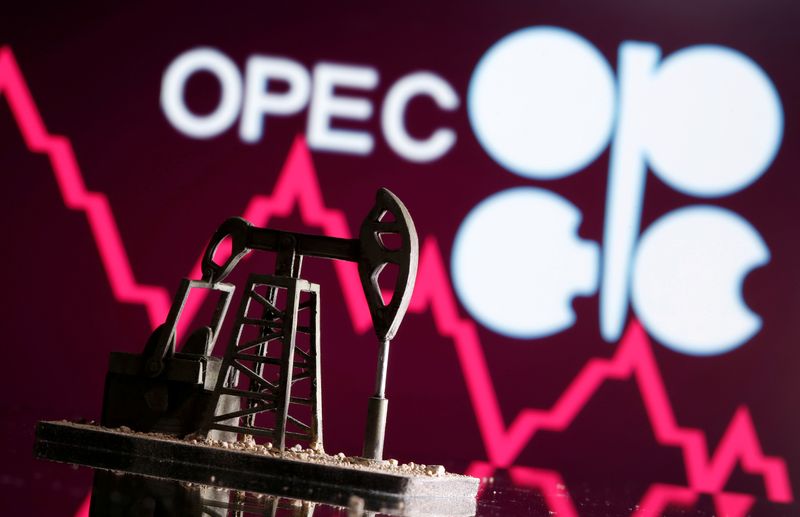 FILE PHOTO: A 3D printed oil pump jack is seen in front of displayed stock graph and Opec logo in this illustration picture